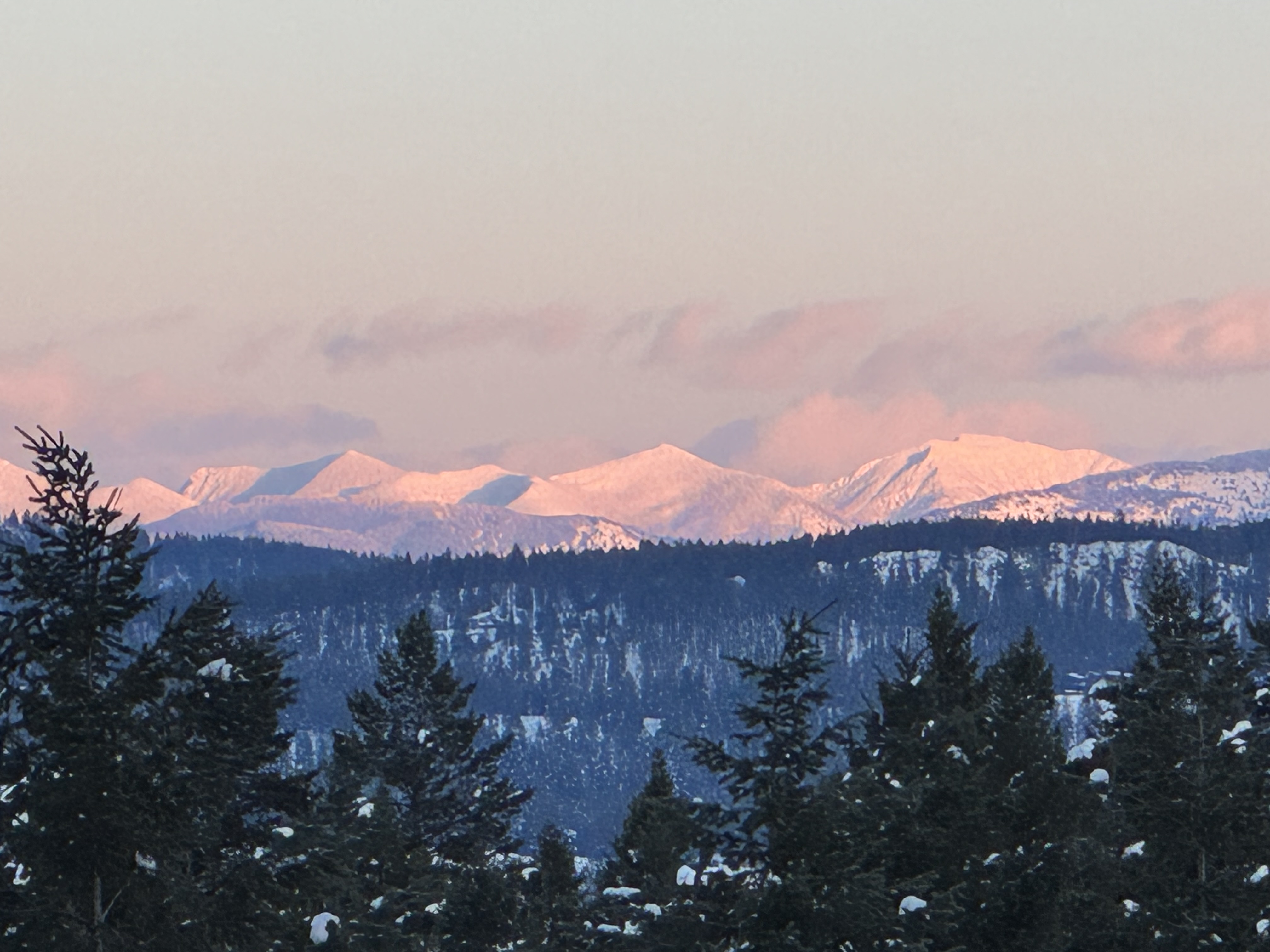 Alpenglow on the Glacier National Park peaks seen from the cabin deck