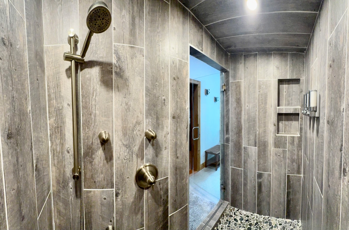 Modern walk-in shower with stone tile